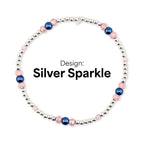 Silver sparkle bracelet with silver beads, pink faceted beads, and navy blue beads. The text "Design: Silver Sparkle" is displayed in black font.