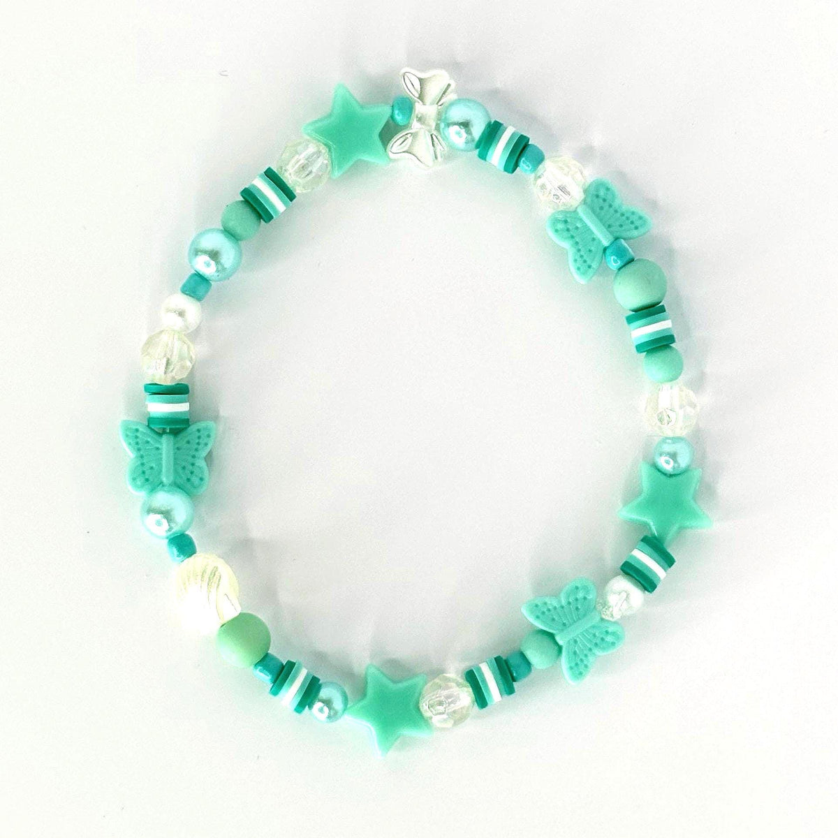 A beaded bracelet featuring a mix of turquoise, white, and clear beads. The bracelet includes star and butterfly-shaped charms. The beads are strung together with a clear elastic cord, creating a playful and whimsical accessory.