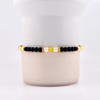 Wild Blooms Bracelet Collection: Black, Cream and Gold Beaded Bracelets