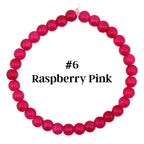A raspberry pink beaded bracelet. The bracelet is made of small, round beads in a vibrant shade of pink. The text "#6 Raspberry Pink" is displayed in black font.