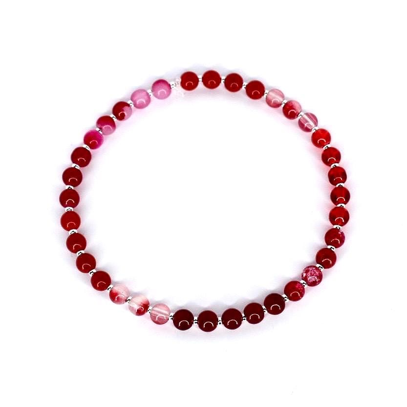 Red agate gemstone stretch bracelet – natural crystal bead jewelry for energy healing and grounding.