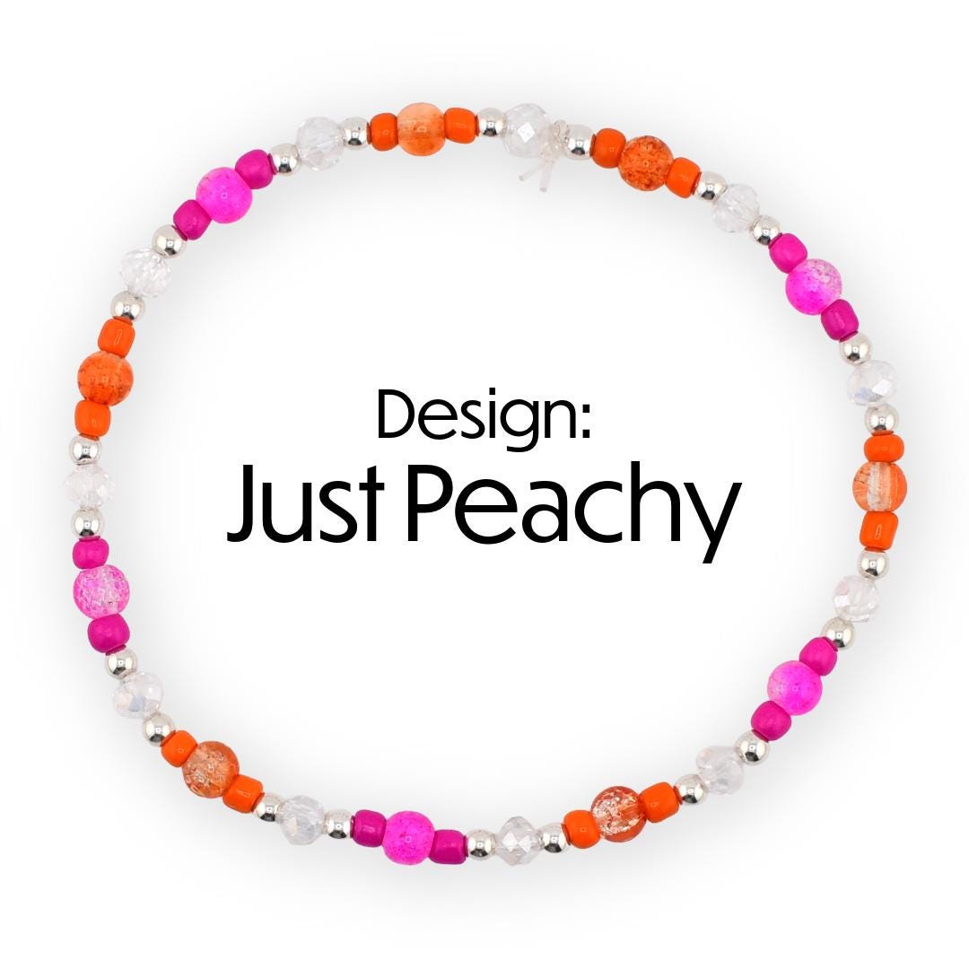 A beaded bracelet with the text "Design: Just Peachy". The bracelet features a circular design with a mix of orange, pink, and clear beads. The beads are interspersed with silver-colored metal beads.