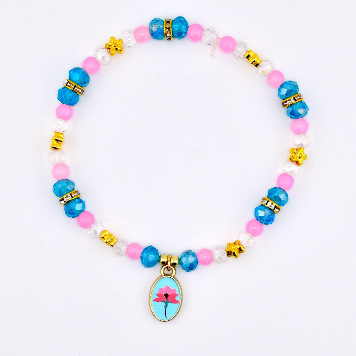 A beaded bracelet featuring pink, blue, and clear beads with gold accents. The bracelet includes a charm with a pink flower design on a light blue background. The bracelet is on a white background.