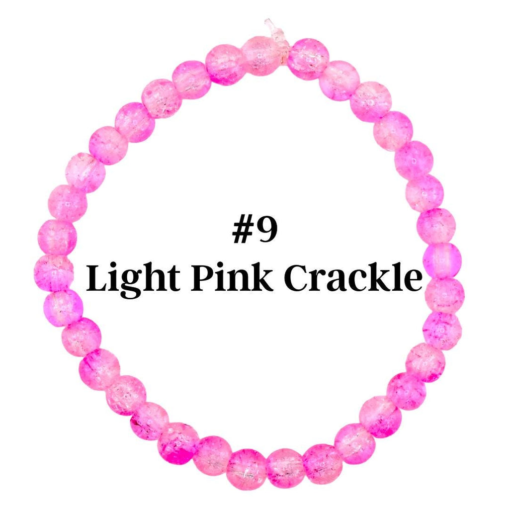 A light pink crackle bead bracelet. The bracelet is made of round, translucent beads with a crackled effect. The text "#9 Light Pink Crackle" is displayed in the center.