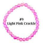 A light pink crackle bead bracelet. The bracelet is made of round, translucent beads with a crackled effect. The text "#9 Light Pink Crackle" is displayed in the center.