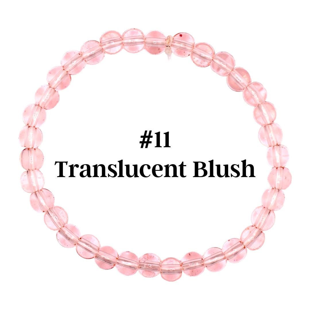 A translucent blush-colored beaded bracelet. The bracelet is made of round, light pink beads strung together. The text "#11 Translucent Blush" is displayed in black font.