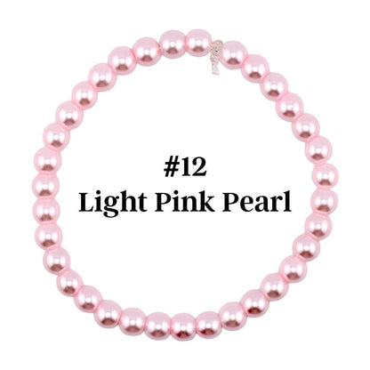A light pink pearl bracelet. The bracelet is made of round, light pink pearls strung together. The text "#12 Light Pink Pearl" is displayed in the center of the bracelet.
