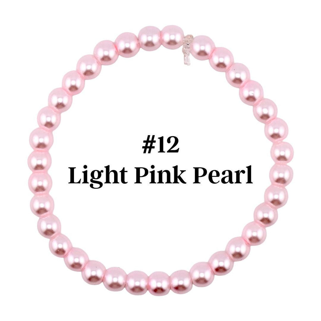 A light pink pearl bracelet. The bracelet is made of round, light pink pearls strung together. The text "#12 Light Pink Pearl" is displayed in the center of the bracelet.