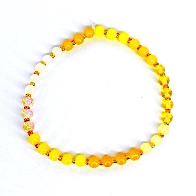 Handmade yellow beaded bracelet – elastic gemstone jewelry for wellness and balance.