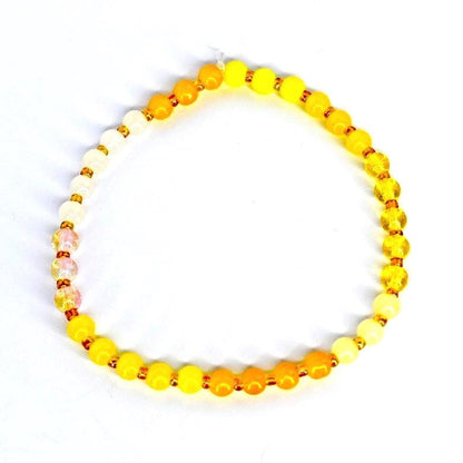 Handmade yellow beaded bracelet – elastic gemstone jewelry for wellness and balance.