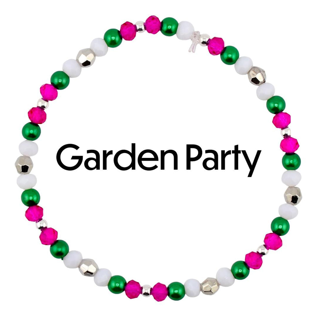 A beaded bracelet with the text "Garden Party". The bracelet features a pattern of pink, green, white, and silver beads. The beads are strung together on a silver chain, creating a circular design.