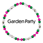 A beaded bracelet with the text "Garden Party". The bracelet features a pattern of pink, green, white, and silver beads. The beads are strung together on a silver chain, creating a circular design.