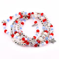 multi-strand beaded bracelets featuring red, white, and blue beads, interspersed with silver-toned metal beads and star charms. The necklace has a patriotic theme, with a mix of round and faceted beads.
