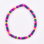 A beaded bracelet featuring a colorful array of beads. The bracelet showcases a combination of vibrant colors, including pink, purple, teal, and gold. The beads are strung together, creating a stylish accessory.