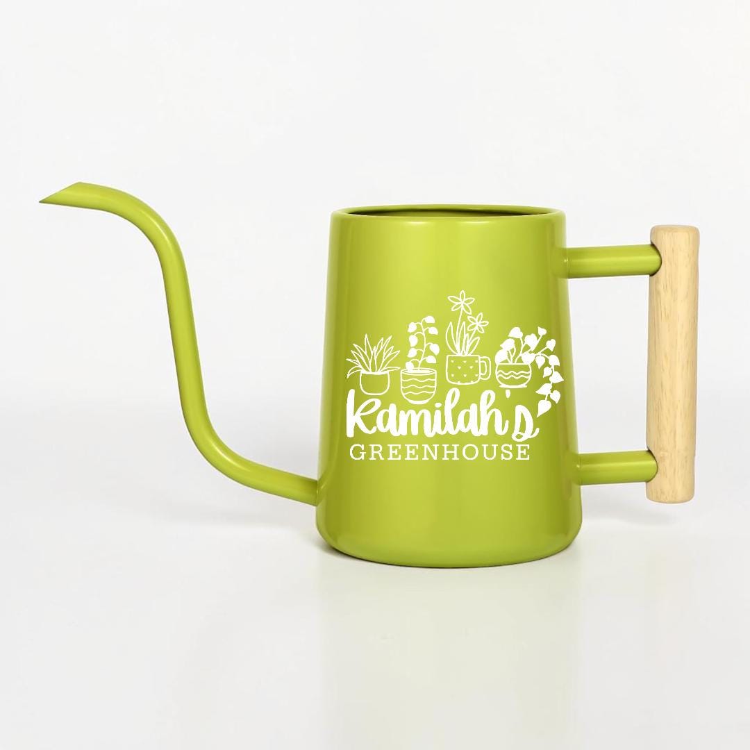A lime green metal watering can with a long, slender spout and a light-colored wooden handle. The side of the can features a white graphic of four potted plants and the text Kamilah's GREENHOUSE printed in a clean, white font.