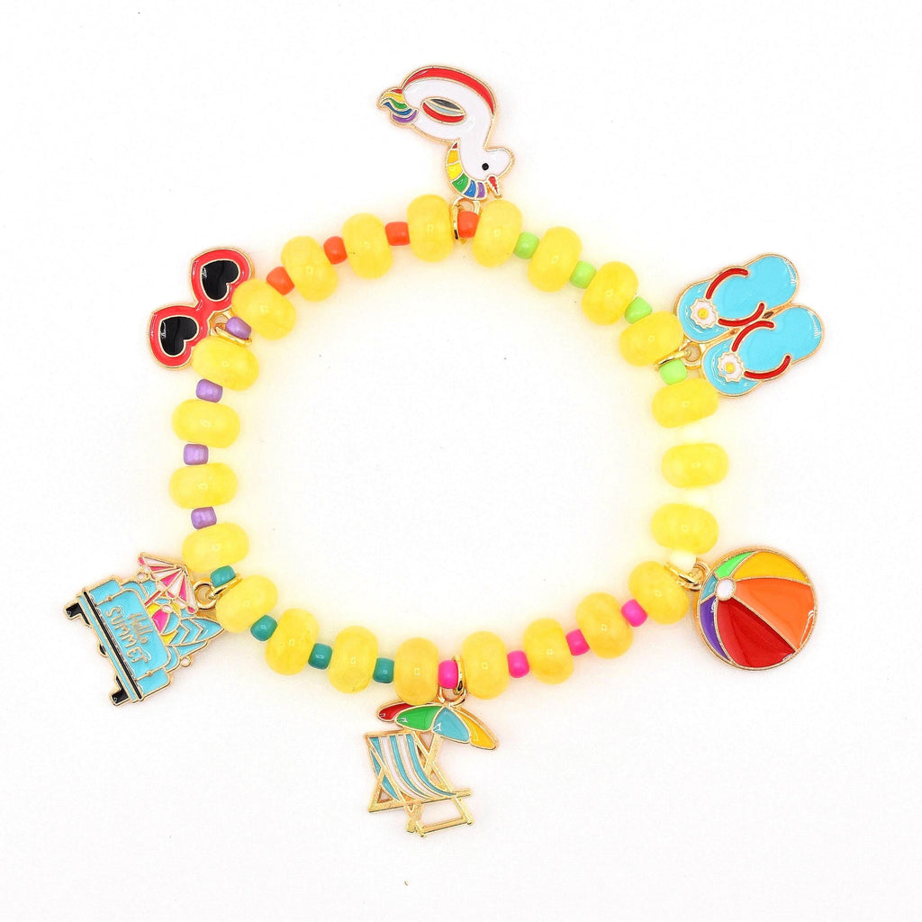 A beaded bracelet featuring yellow circular beads interspersed with small colorful beads. The bracelet includes six metal charms: a unicorn float, red heart-shaped sunglasses, blue flip-flops, a beach ball, a beach chair, and a blue van.