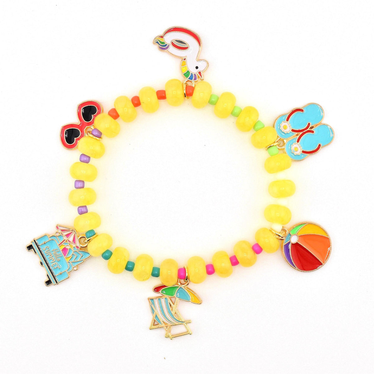 A beaded bracelet featuring yellow circular beads interspersed with small colorful beads. The bracelet includes six metal charms: a unicorn float, red heart-shaped sunglasses, blue flip-flops, a beach ball, a beach chair, and a blue van.