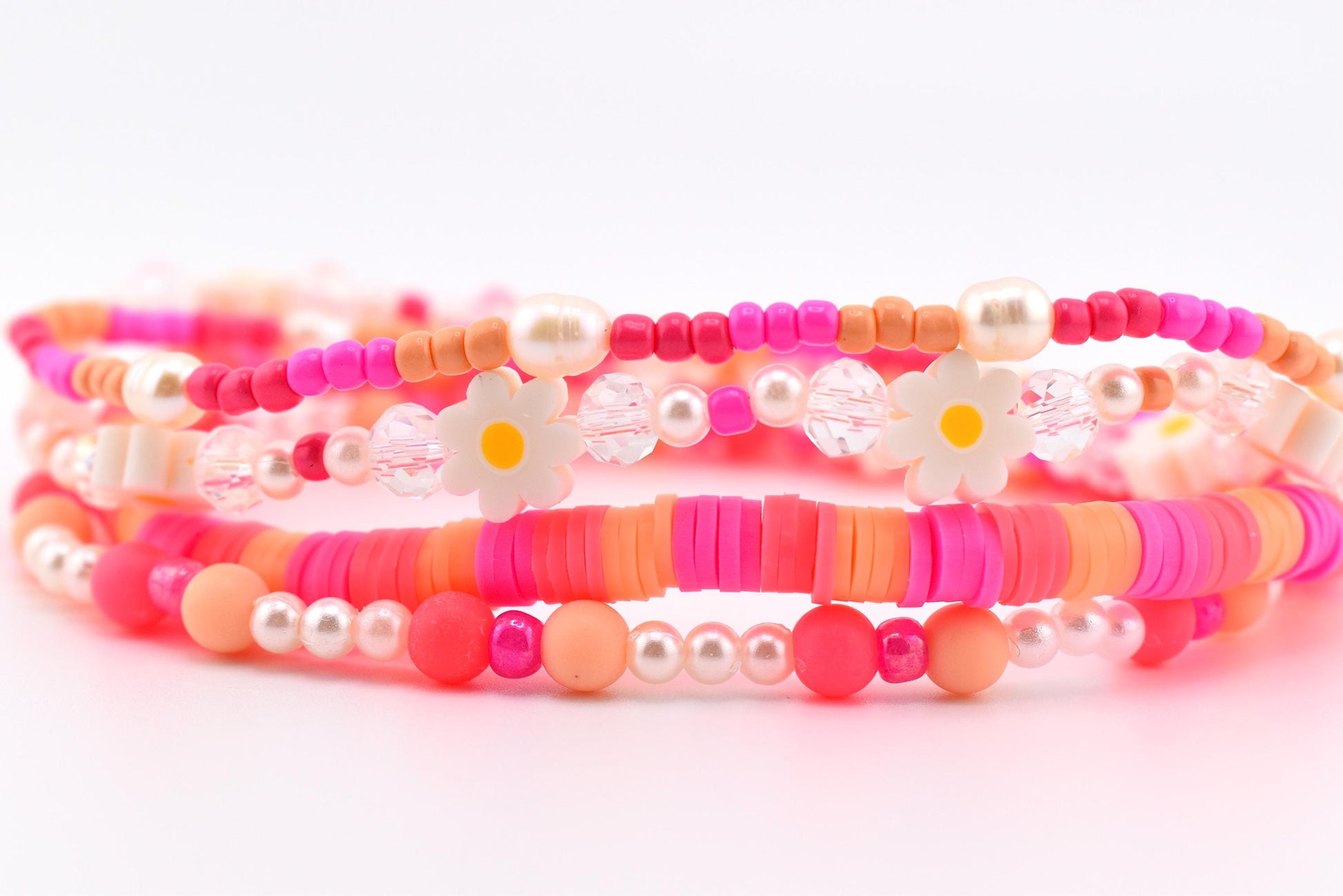 Sorbet Groove Bracelet Collection: Pink and Orange Beaded Bracelets with Daisy Accents