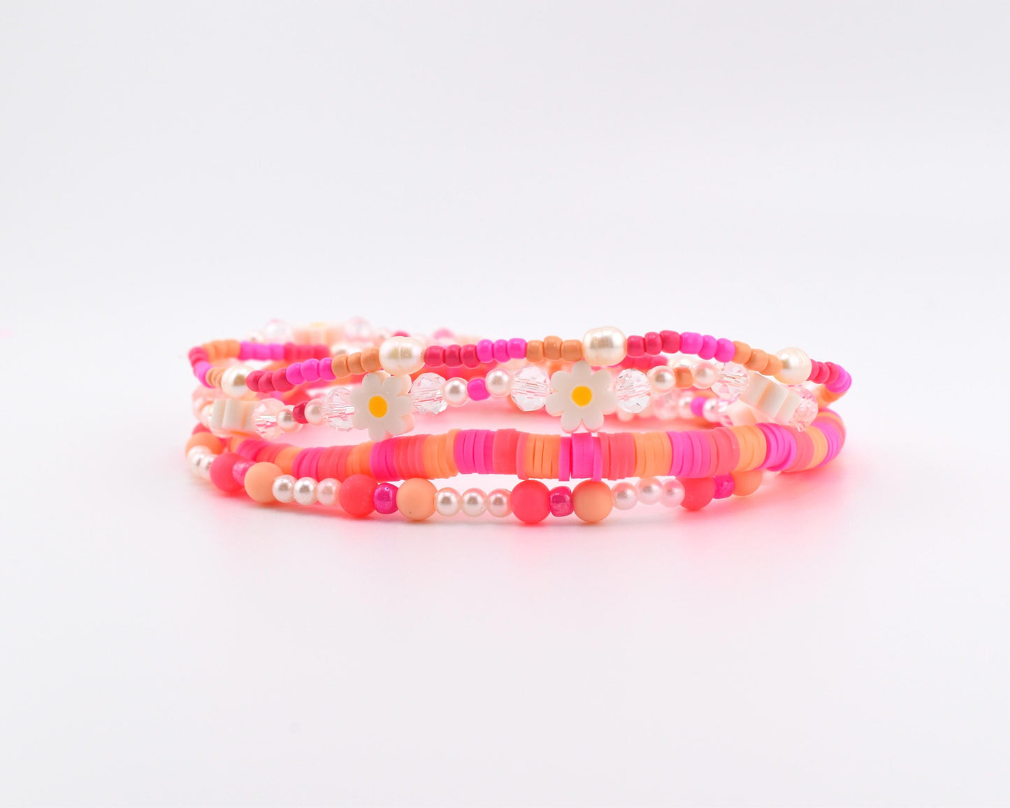 Sorbet Groove Bracelet Collection: Pink and Orange Beaded Bracelets with Daisy Accents
