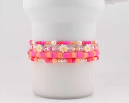 Sorbet Groove Bracelet Collection: Pink and Orange Beaded Bracelets with Daisy Accents