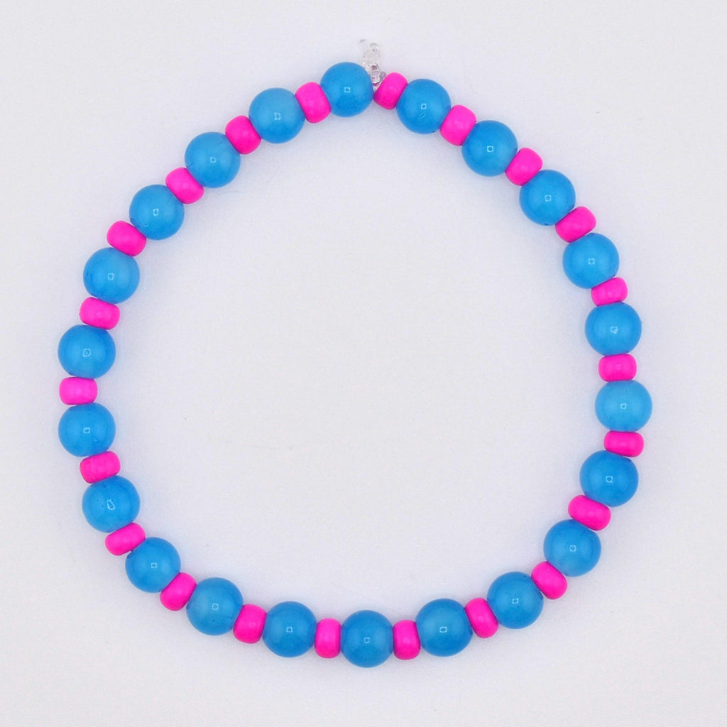 A beaded bracelet featuring alternating blue and pink beads. The bracelet is made of round, glossy blue beads interspersed with smaller, cylindrical pink beads. The design is simple and colorful, suitable for everyday wear.
