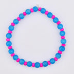 A beaded bracelet featuring alternating blue and pink beads. The bracelet is made of round, glossy blue beads interspersed with smaller, cylindrical pink beads. The design is simple and colorful, suitable for everyday wear.