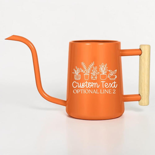 An orange metal watering can with a long, thin spout and a light-colored wooden handle. The side features a white line-art graphic of five potted plants above the text Custom Text and OPTIONAL LINE 2 in a white script font.