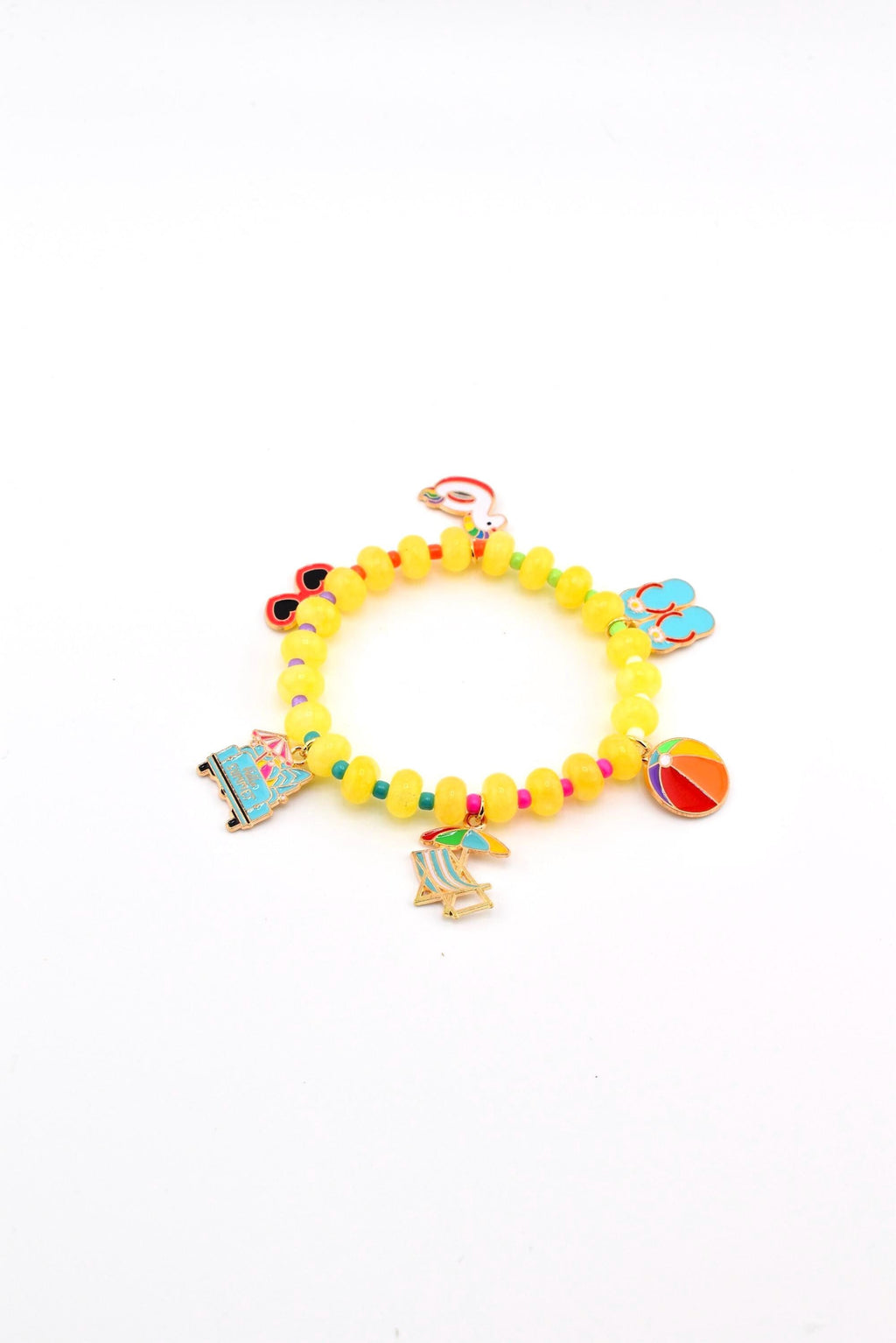 A yellow beaded bracelet featuring multiple metal charms including a beach chair, a beach ball, a camper van, sunglasses, flip-flops, and a flamingo float. The beads are round and translucent yellow, accented with small colorful spacer beads.