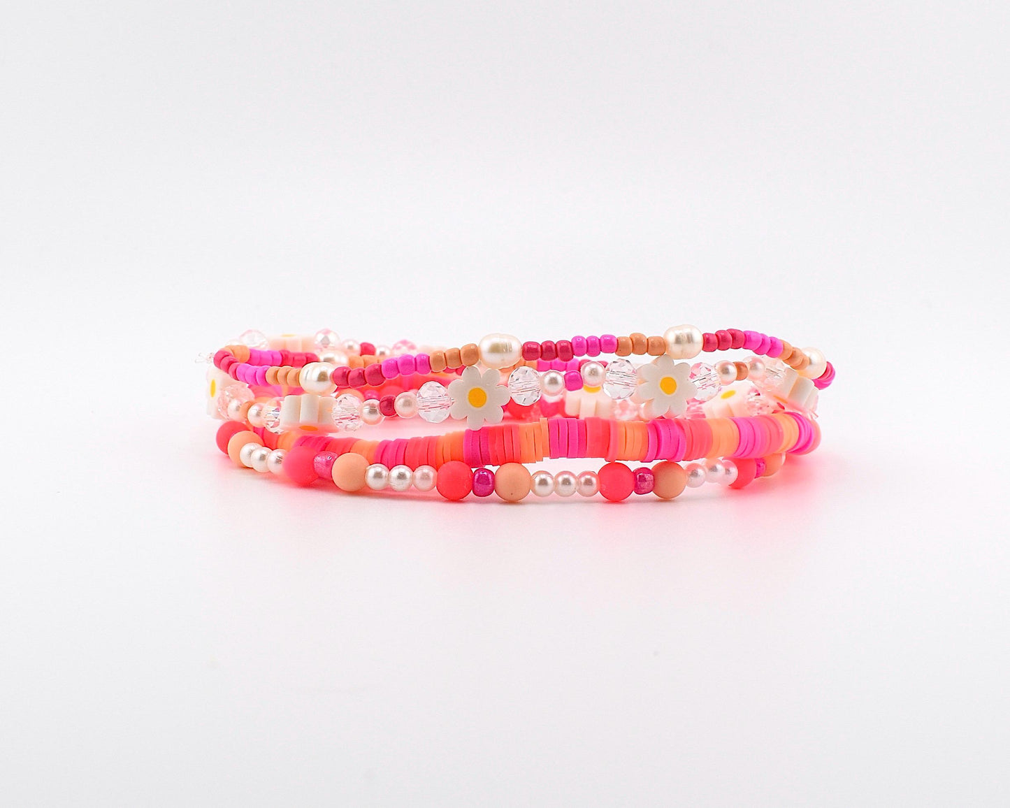 Sorbet Groove Bracelet Collection: Pink and Orange Beaded Bracelets with Daisy Accents