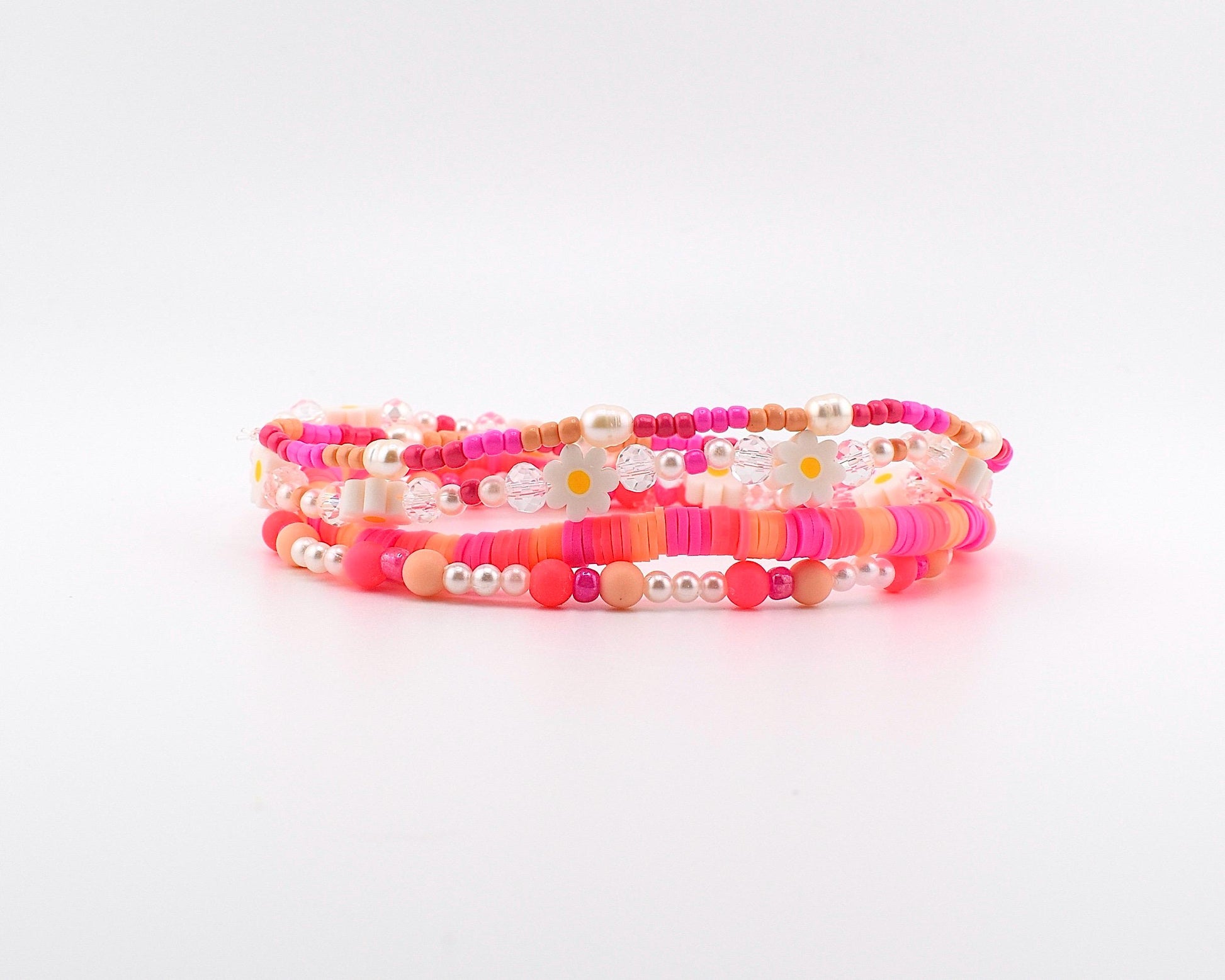 Sorbet Groove Bracelet Collection: Pink and Orange Beaded Bracelets with Daisy Accents