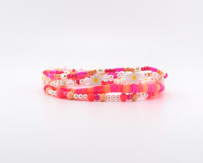 Sorbet Groove Bracelet Collection: Pink and Orange Beaded Bracelets with Daisy Accents