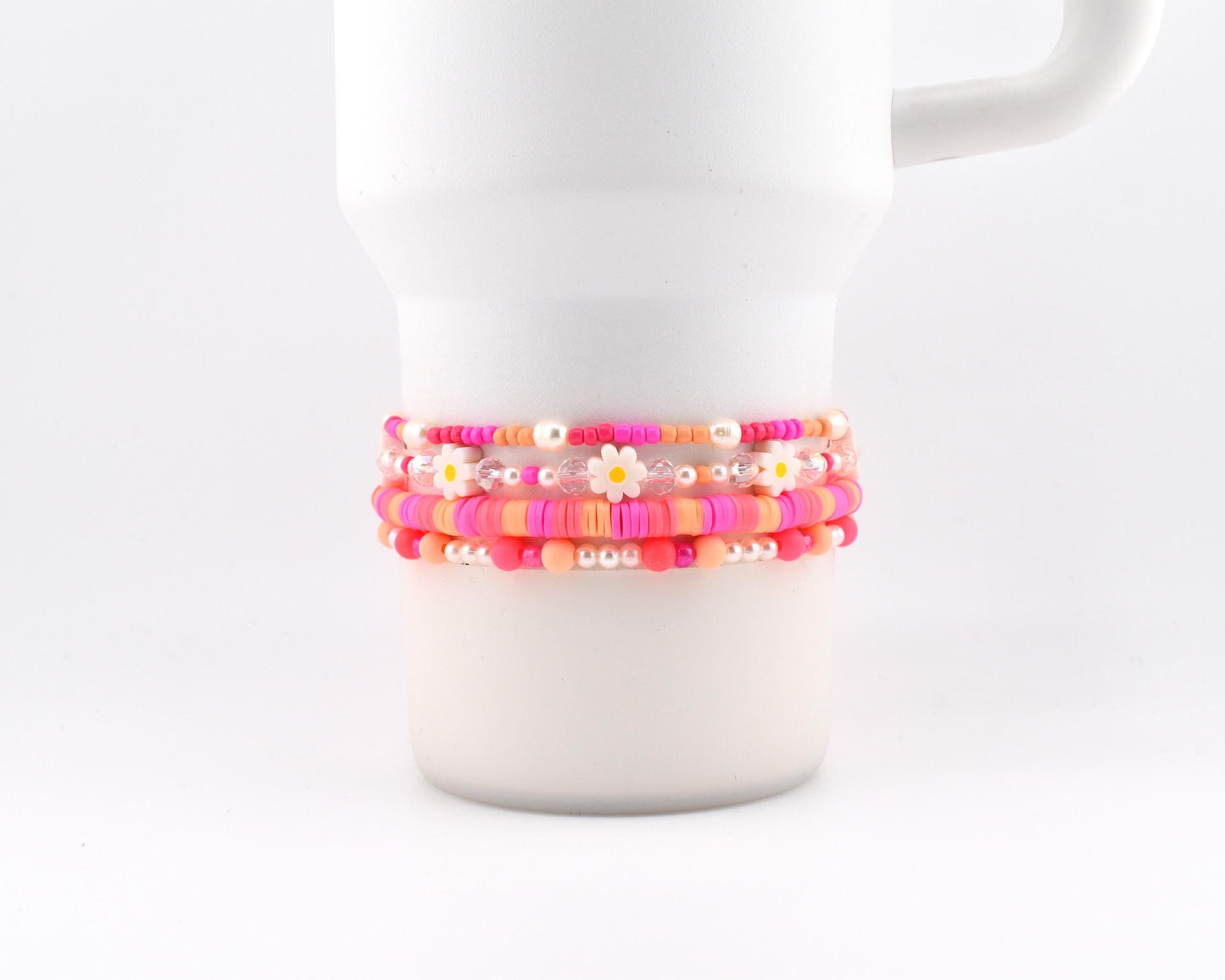 Sorbet Groove Bracelet Collection: Pink and Orange Beaded Bracelets with Daisy Accents
