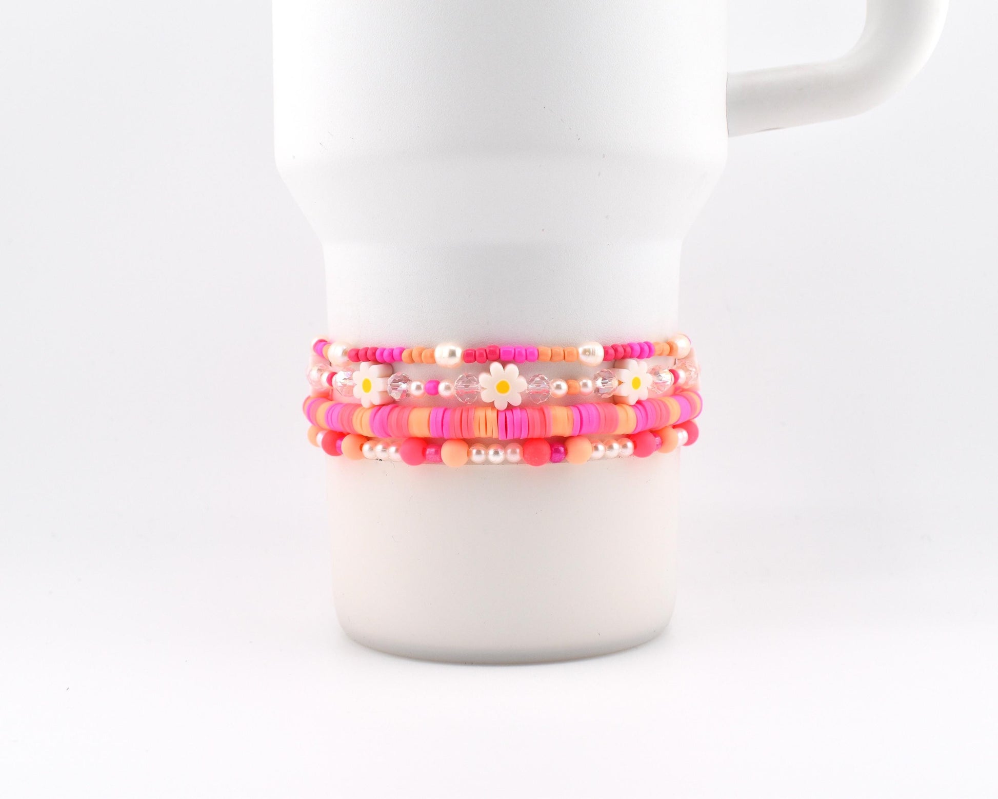 Sorbet Groove Bracelet Collection: Pink and Orange Beaded Bracelets with Daisy Accents