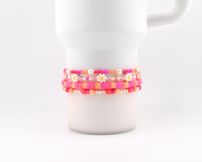 Sorbet Groove Bracelet Collection: Pink and Orange Beaded Bracelets with Daisy Accents