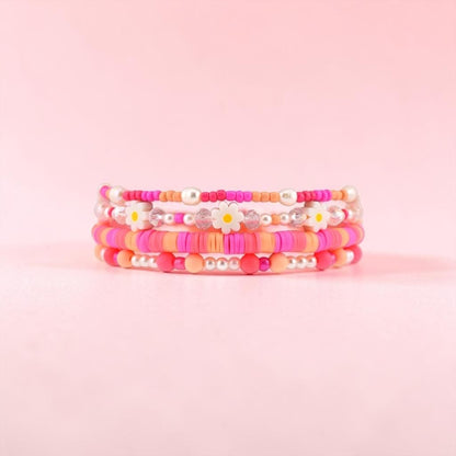 Sorbet Groove Bracelet Collection: Pink and Orange Beaded Bracelets with Daisy Accents
