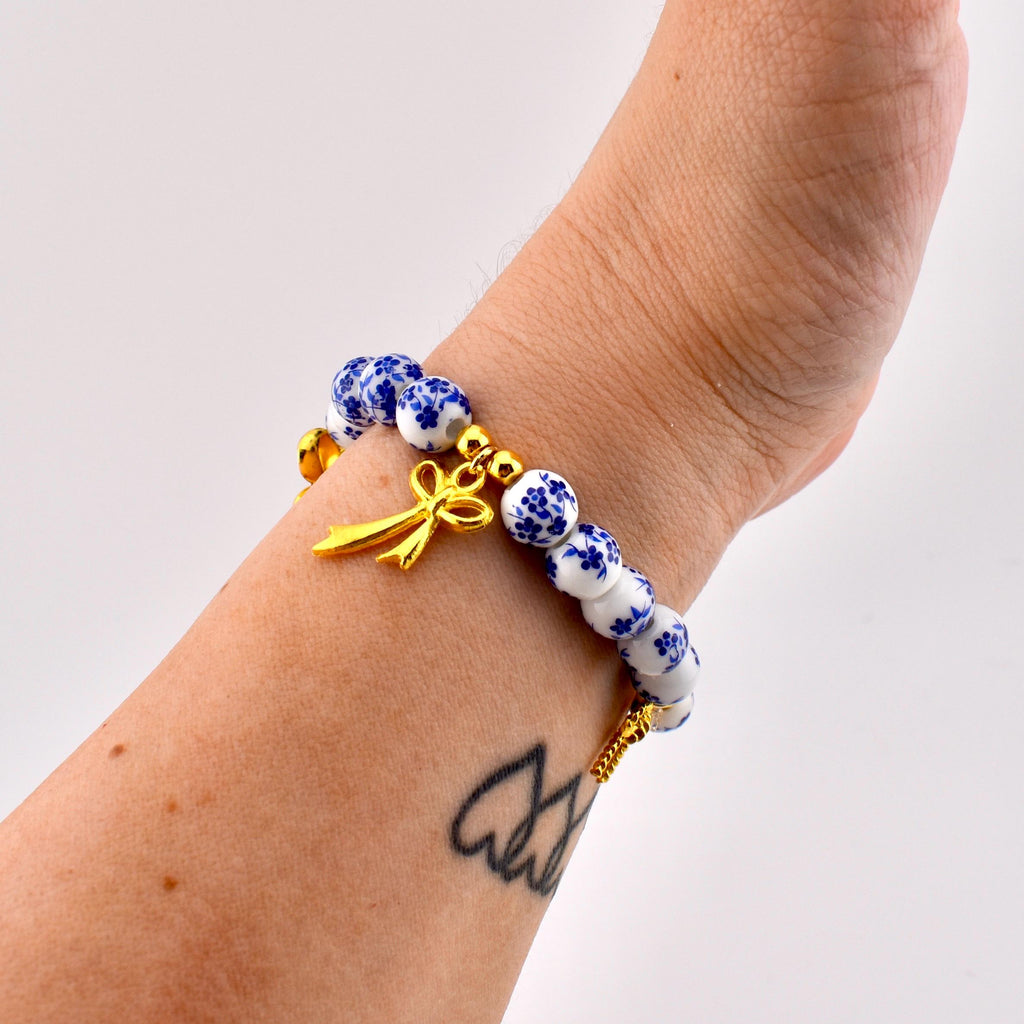 Porcelain Bow Bracelet | Blue and White Porcelain Flower Beads with Gold Bow Charms