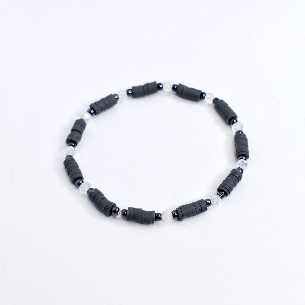 Handmade spooky tumbler bracelet stack – black and gray beads with spider web and skeleton charms for Halloween or gothic cup accessories.