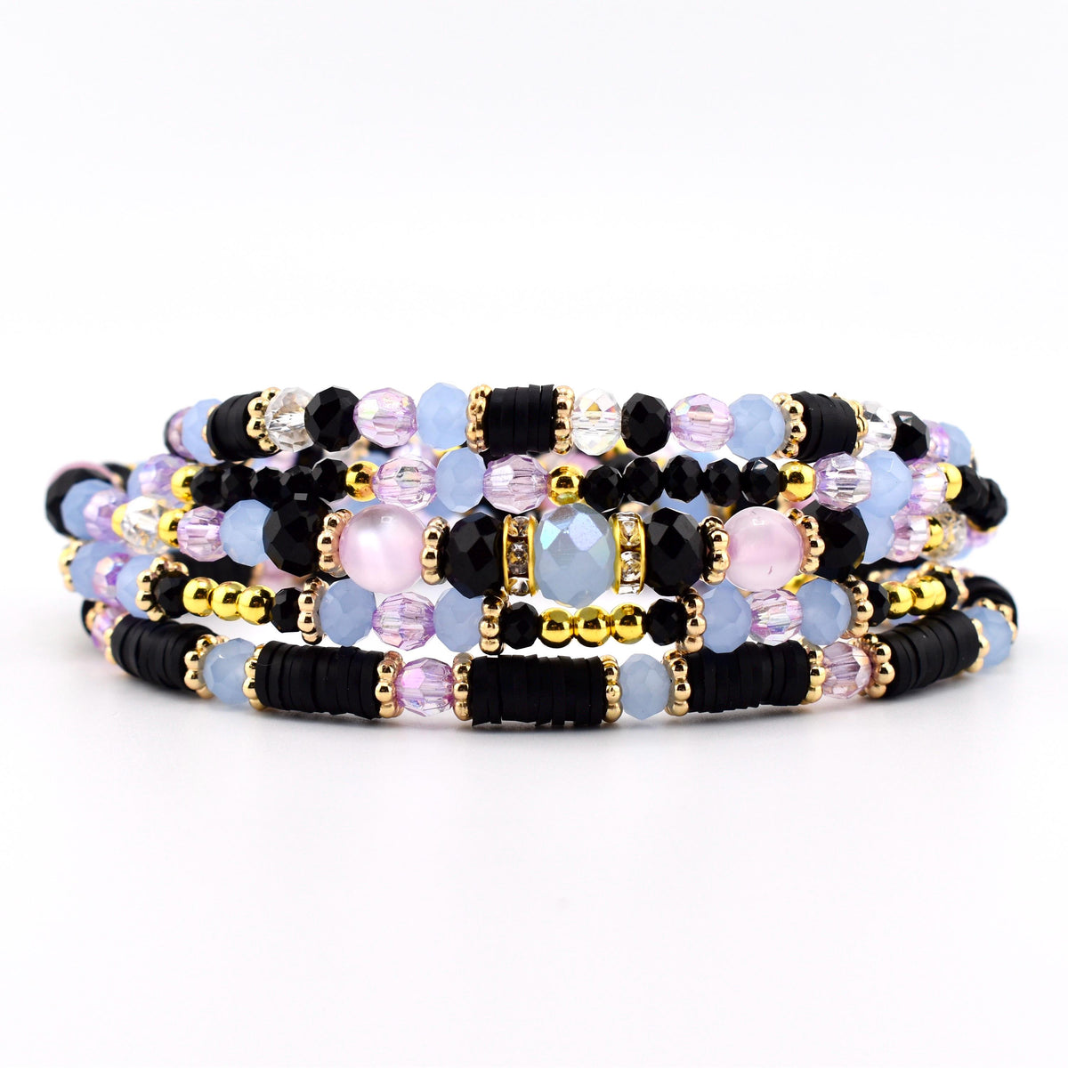 A multi-strand wrap bracelet featuring a combination of black disc-shaped beads, light blue faceted beads, pale pink round beads, and metallic gold spacers. The design incorporates clear crystal accents and small gold-toned metal beads.
