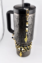 Black and Gold Snake or Moth Straw Charm