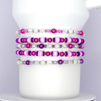 Set of beaded bracelets in pink purple silver and white beads