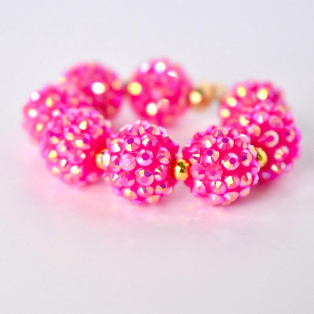 Pink beaded bracelet on a white table