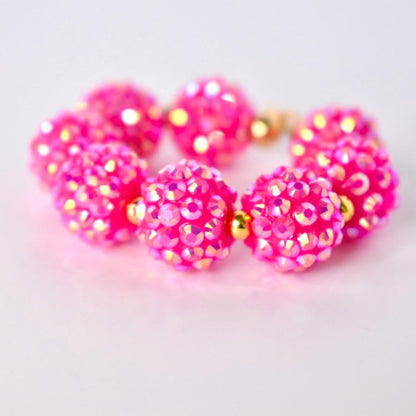 Pink beaded bracelet on a white table