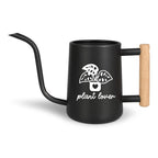 Black metal watering can with a long spout and wooden handle. The can features a white graphic of a potted plant with the words "plant lover" in a script font. Ideal for indoor or outdoor plant care.